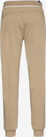 PUMA Tapered Workout Pants 'Squad' in Beige