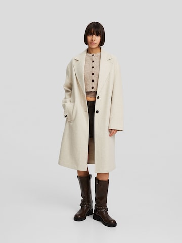 Bershka Between-seasons coat in Beige: front