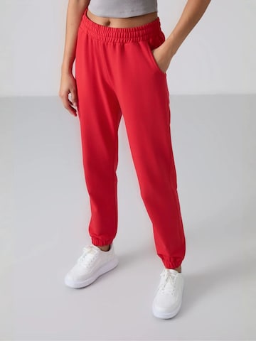 Tommy Life Tapered Trousers in Red: front