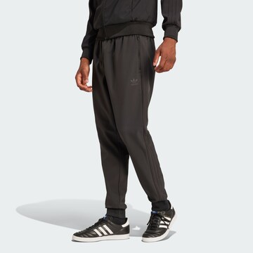 Tapered Pantaloni di ADIDAS ORIGINALS in nero: frontale