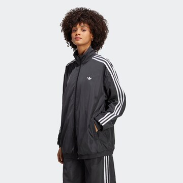 ADIDAS ORIGINALS Übergangsjacke in Schwarz: predná strana