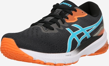 Chaussure de course ASICS en noir : devant