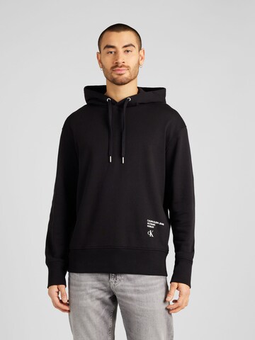 Sweat-shirt Calvin Klein Jeans en noir : devant