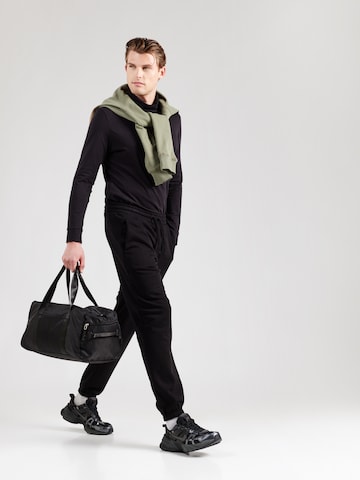 Tapered Pantaloni sport de la 4F pe negru