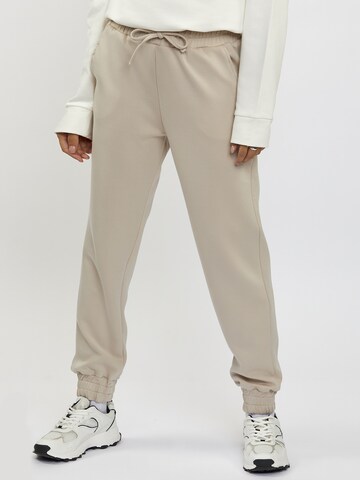 FRESHLIONS Tapered Pants in Beige: front