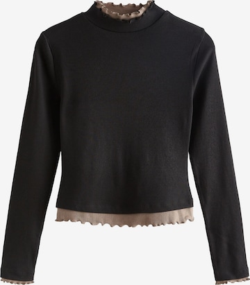 Next T-shirt i svart: framsida