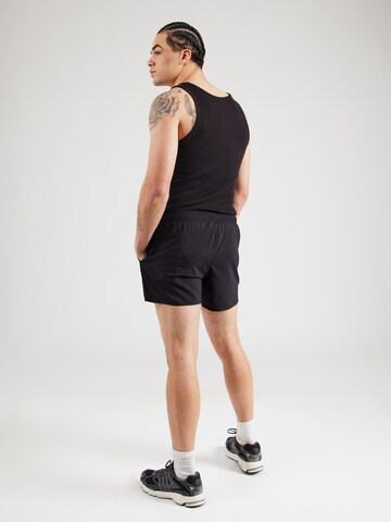 regular Pantaloni sportivi di ASICS in nero