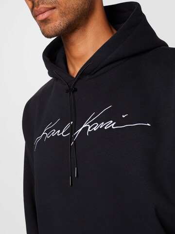 Karl Kani Tréning póló 'Autograph' - fekete