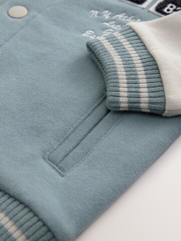 Next Tussenjas in Blauw