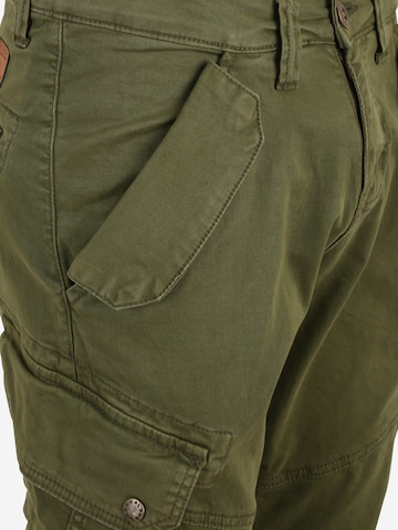 ALPHA INDUSTRIES Tapered Cargo trousers 'Combat' in Green