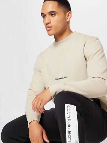 Calvin Klein Jeans Sweatshirt 'INSTITUTIONAL' in Beige