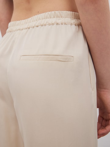 EDITED Zvonové kalhoty Kalhoty 'Benja' – béžová
