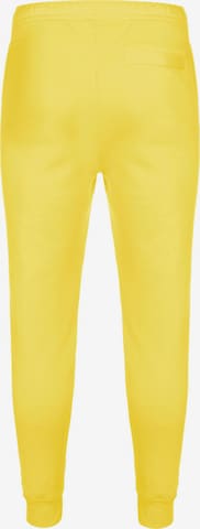 Nike Sportswear Tapered Pants 'Club Fleece' in Yellow