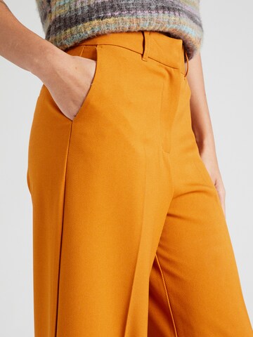 King Louie Loosefit Παντελόνι με τσάκιση 'Chloe' σε πορτοκαλί