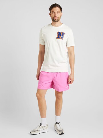 Loosefit Pantalon 'CLUB' Nike Sportswear en rose