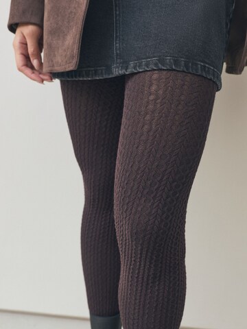 Next - Leotardos en marrón