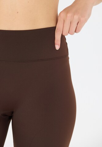 Athlecia Skinny Tights 'Blossom' in Braun