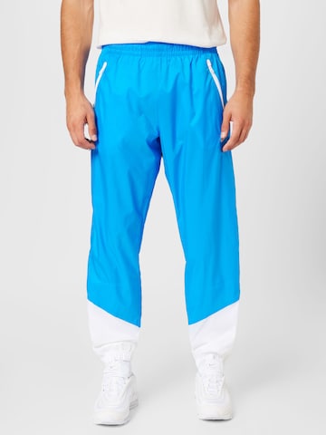 Tapered Pantaloni de la Nike Sportswear pe albastru: față