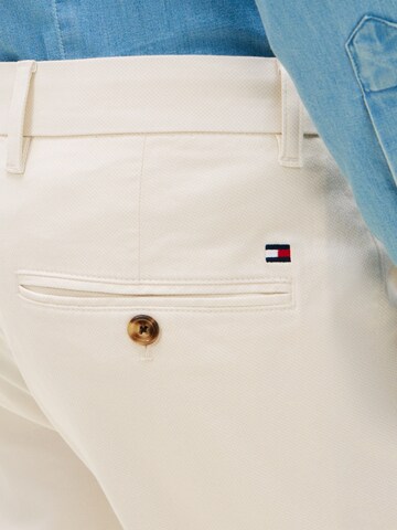 TOMMY HILFIGER Slimfit Housut värissä keltainen