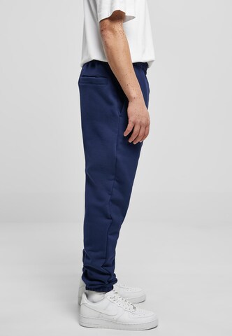 Tapered Pantaloni di Urban Classics in blu