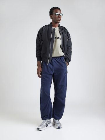 Nike Sportswear Tapered Hose 'Tech' in Blau