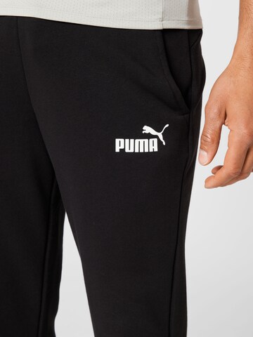 PUMA Normalny krój Spodnie sportowe 'Essentials' w kolorze czarny