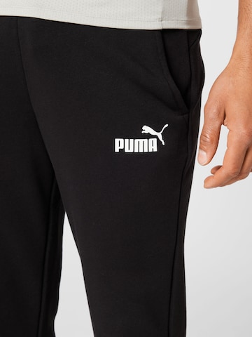 PUMA - Regular Calças de desporto 'Essentials' em preto