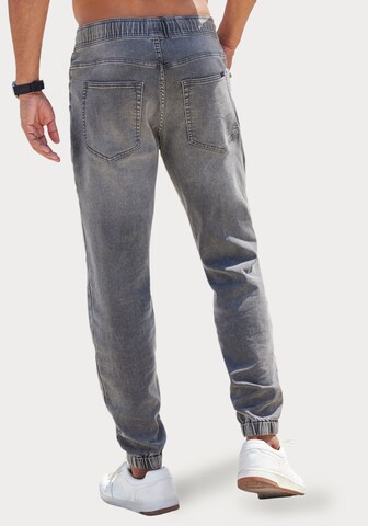 JOHN DEVIN Tapered Jeans in Grau