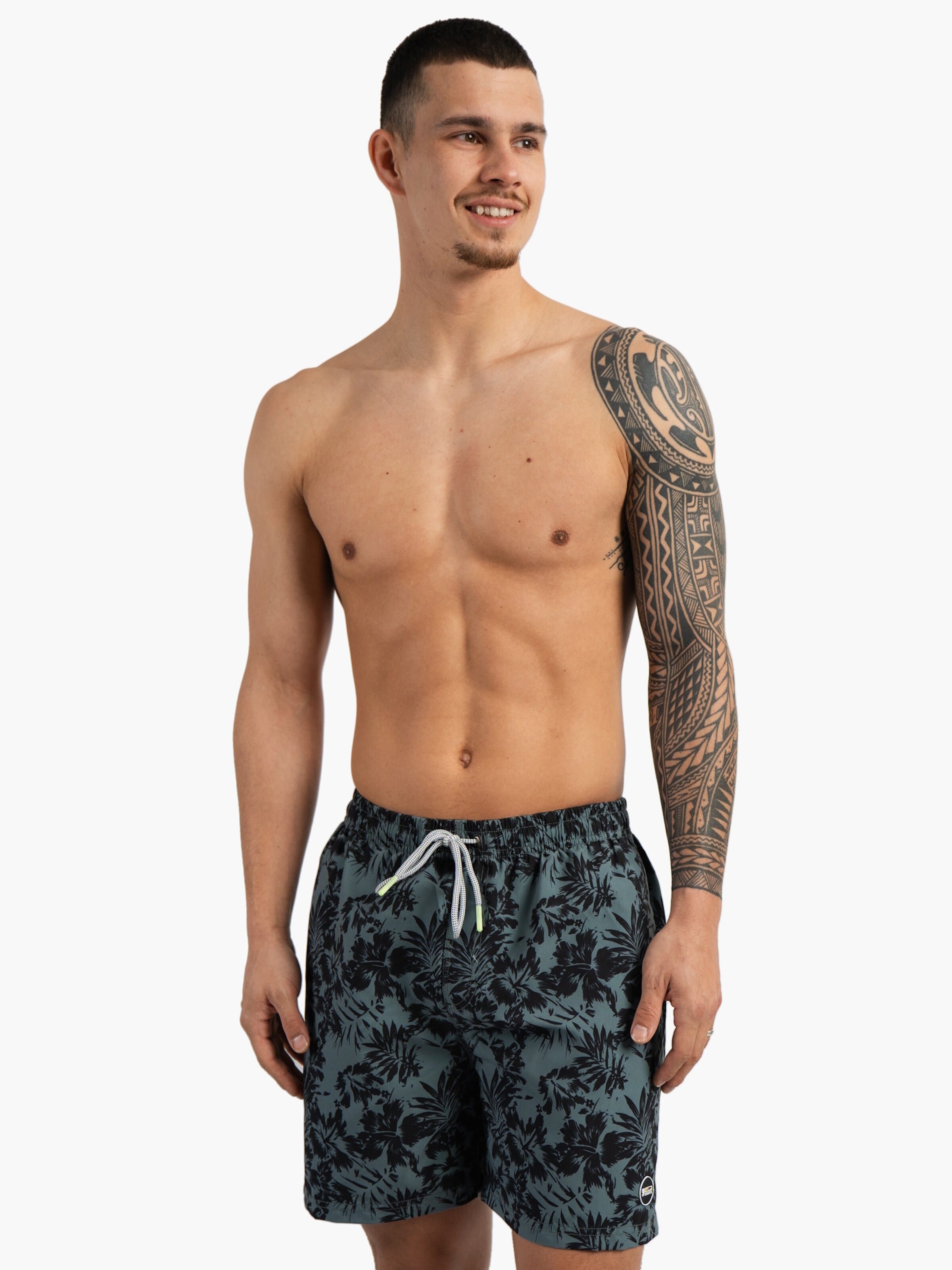 Happy Shorts Board Shorts in Green: front