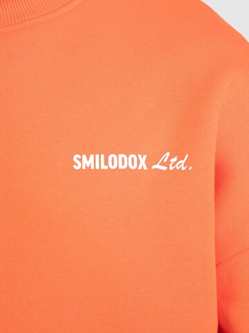 Smilodox Sweatshirt ' Liquid Brail ' in Orange