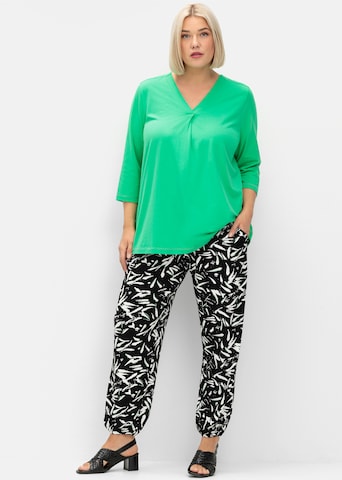 SHEEGO - Tapered Pantalón en negro
