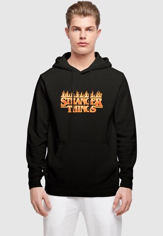 ABSOLUTE CULT Sweatshirt 'Stranger Things - Fire' in Schwarz: Vorderseite