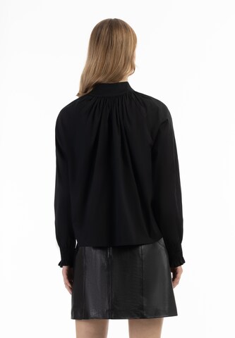 Camicia da donna di faina in nero