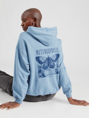 Kaotiko Sweatshirt 'METAMORPHOSIS' i blå: framsida