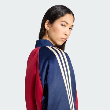 ADIDAS ORIGINALS - Chaqueta de entretiempo 'SST' en rojo