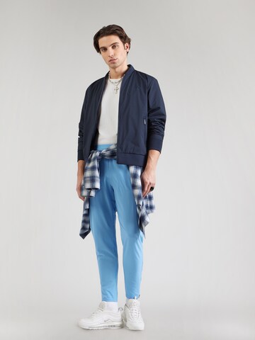 Effilé Pantalon Nike Sportswear en bleu