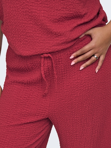ONLY Carmakoma - Pierna ancha Pantalón 'CARERIKKA' en rojo
