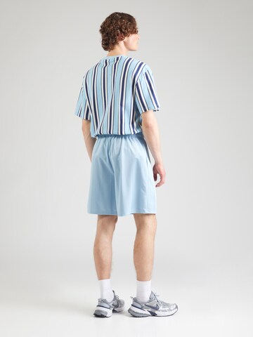Karl Kani Regular Trousers in Blue