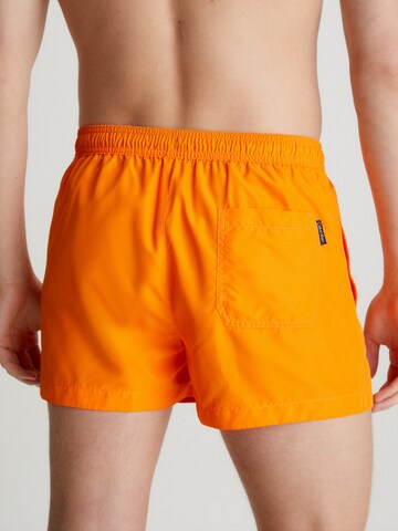 Calvin Klein Swimwear Kratke kopalne hlače | oranžna barva