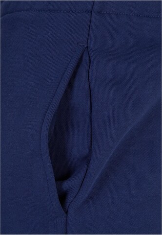 Tapered Pantaloni di Urban Classics in blu