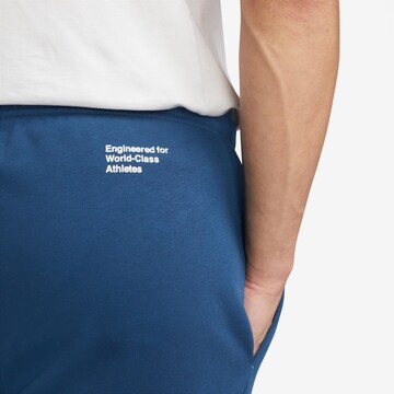 NIKE Tapered Funktionshose in Blau