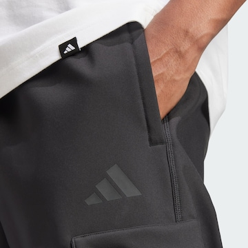 Tapered Pantaloni funzionali 'City Escape Premium' di ADIDAS SPORTSWEAR in nero