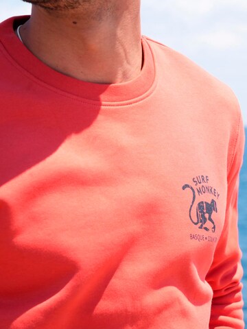 Surf Monkey - Sudadera 'Rette das Ozean' en rojo
