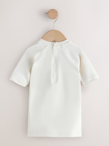 Next UV-skydd i beige