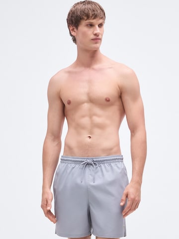 Calvin Klein Swimwear Hlače za k noši | siva barva