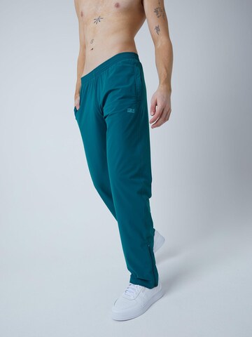 SPORTKIND Regular Sporthose 'Woven Training Pants'‌‌‌‌‌‌‌‌‌‌ in Grün