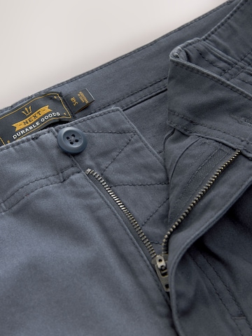 Next Slimfit Gargohousut värissä sininen