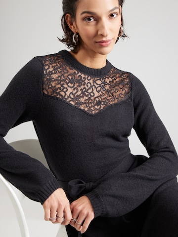 juoda ABOUT YOU Megzta suknelė 'Tara'