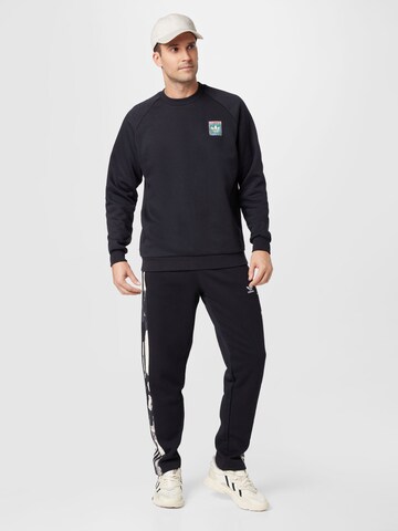 ADIDAS ORIGINALS Regular Broek 'Camo Series Sweat' in Zwart