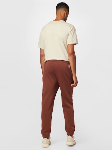 Tapered Pantaloni de la Champion Authentic Athletic Apparel pe maro